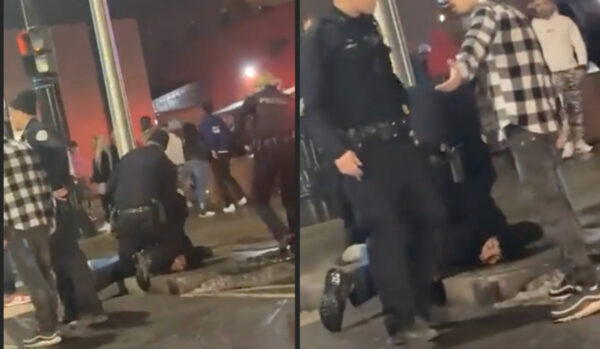 A Binghamton Police officer kneels on Hamail Waddell's neck.