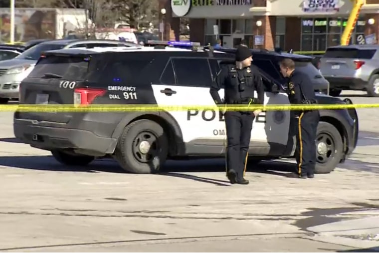 Police investigate the scene of a suspected active shooter at a Target, in Omaha, Neb., on Tuesday.