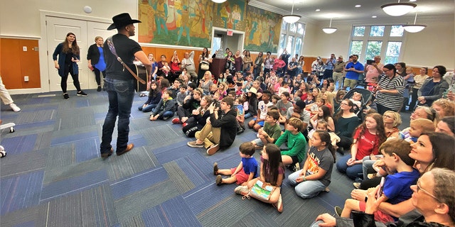 Texas native Coffey Anderson performs in a family-filled room at the Chatham County Public Library in Savannah, Georgia, on Thursday, Feb. 9. 