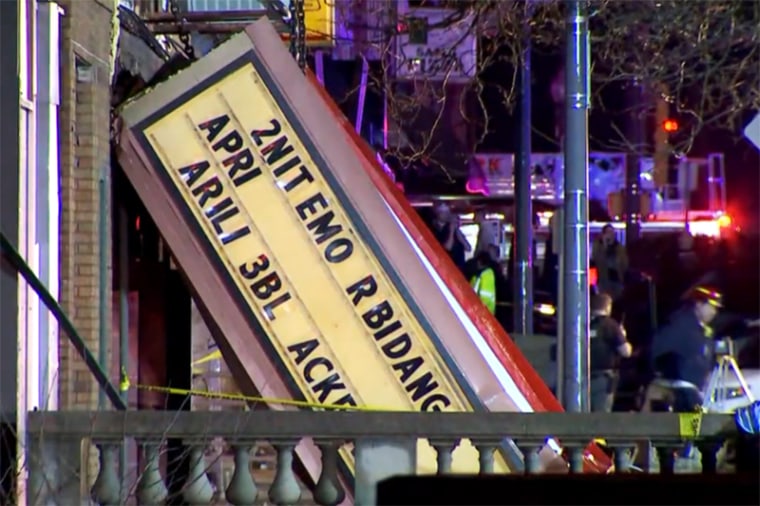 Emergency responders work near a collapsed theatre in Belvidere, Ill., on Friday. 