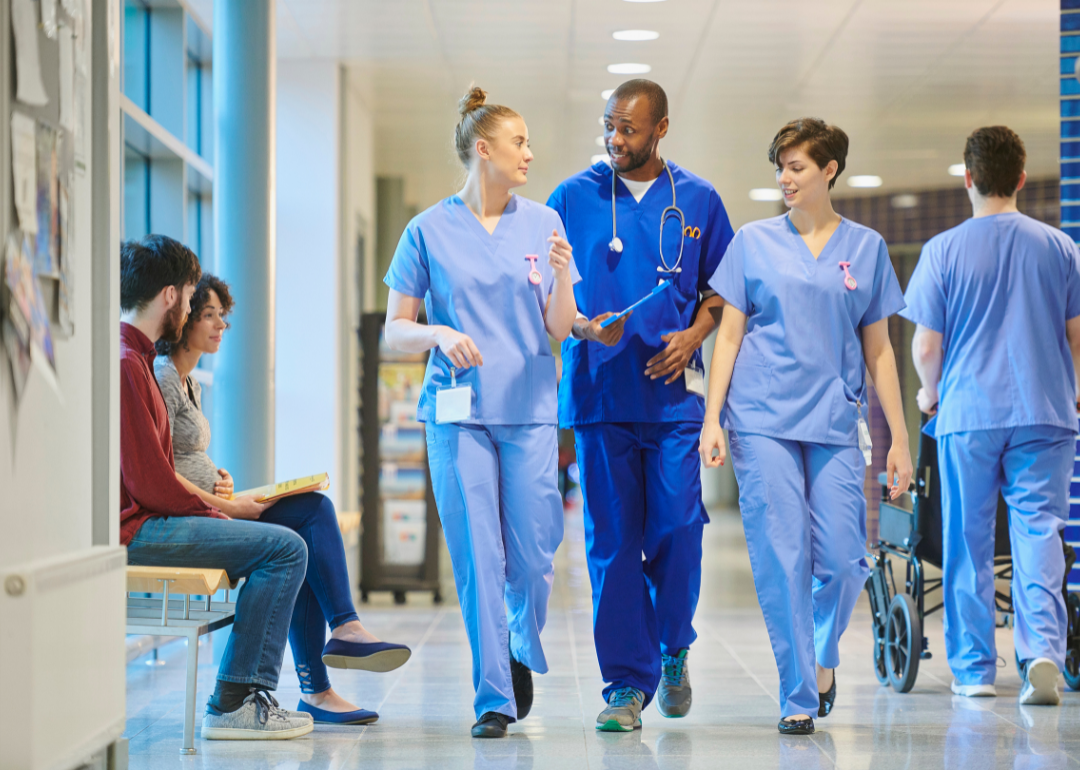 #47. Hospitals Doctors walking down a hospital hallway.