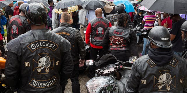 Outcast Motorcycle Club members wearing their biker vests