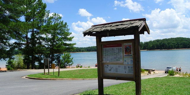 A sign by the lake