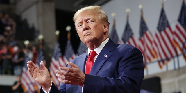 Former President Donald Trump clapping