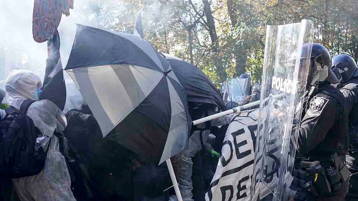 protesters and police clash