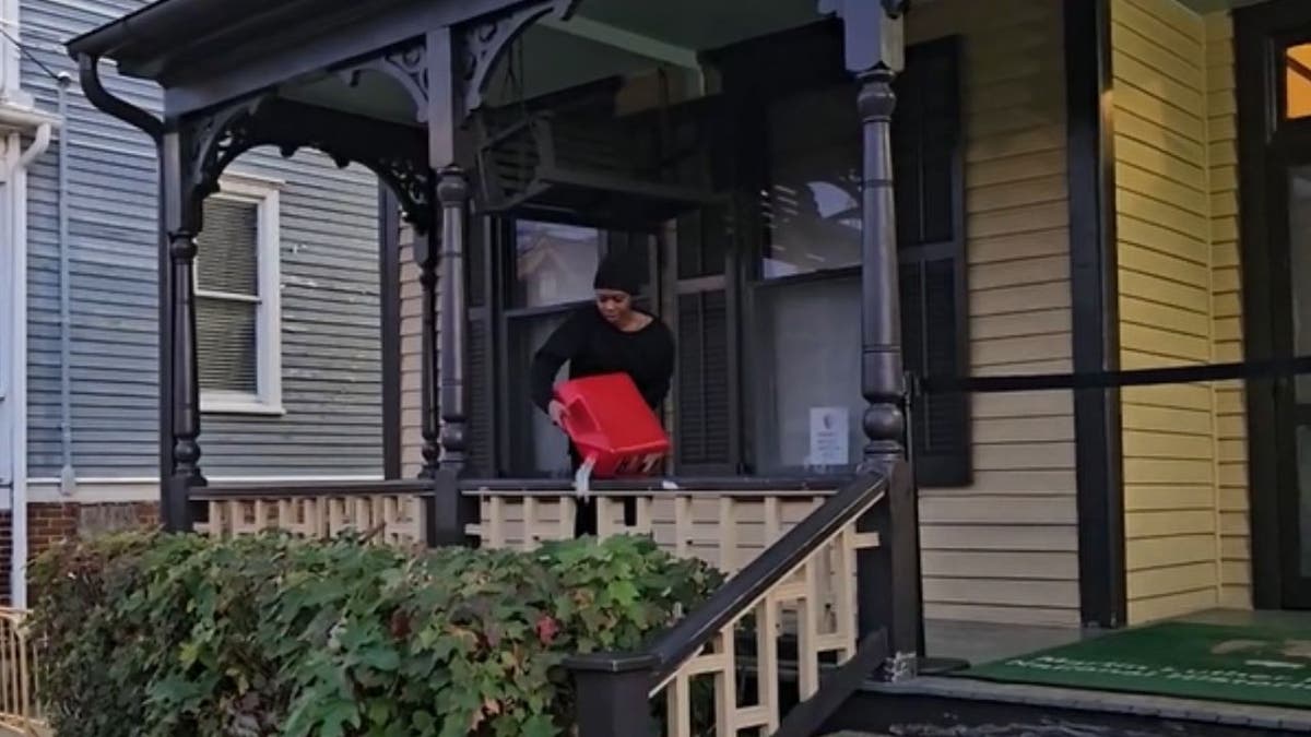 a woman pouring gasoline into plants