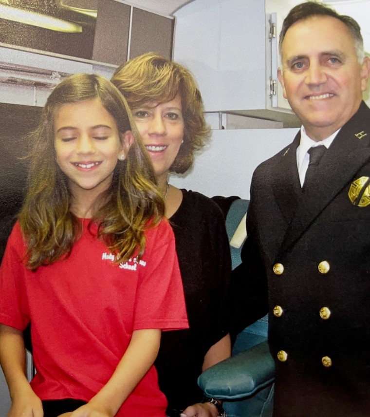 The writer in late 2007 or early 2008 with her mom, Wendy, and dad, Dean, on a blood donation truck