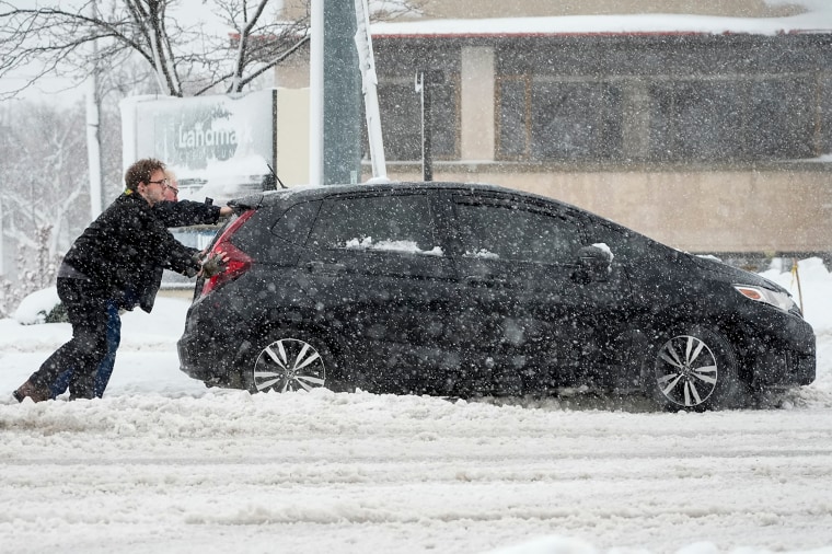winter weather car stuck heavy snow