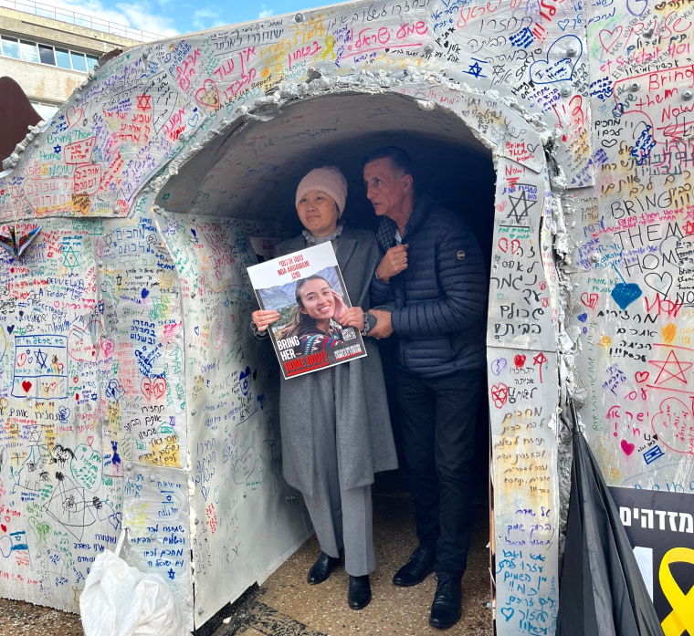 Noa Argamani's mother, Liora Argamani, and father, Yaakov Argamani, emerge from a tunnel set up in Tel Aviv to recreate the conditions those taken hostage by Hamas, including their daughter could be held in.